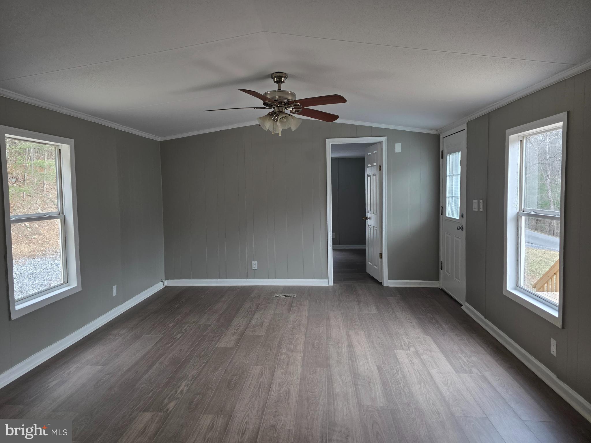 2732 Crossroad School Road Hedgesville, WV 25427 - Photo 22 of 41 wooden floor in an empty room with a window