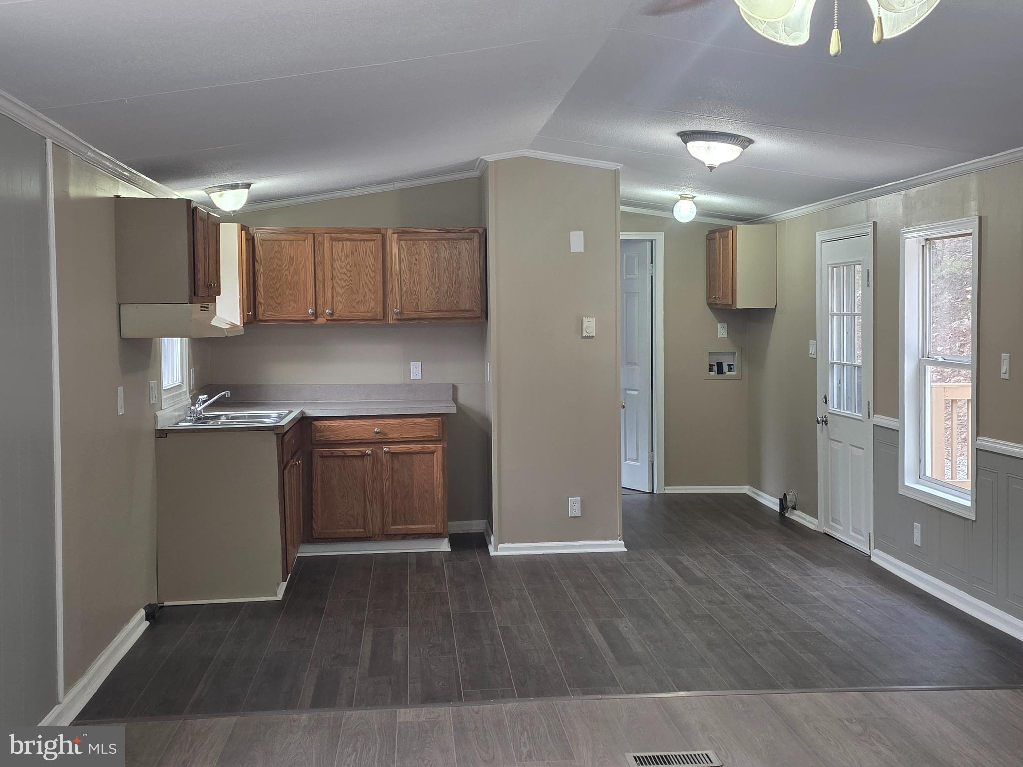 2732 Crossroad School Road Hedgesville, WV 25427 - Photo 27 of 41 a kitchen with a refrigerator and a stove top oven