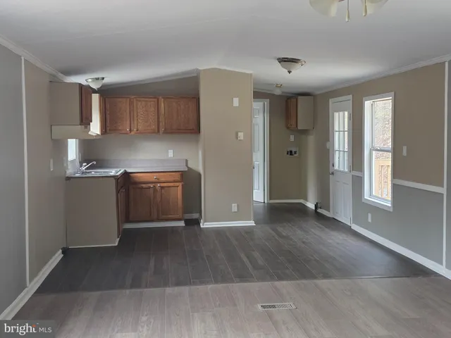 a kitchen with a sink and a stove top oven