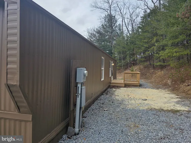 a view of a backyard of the house
