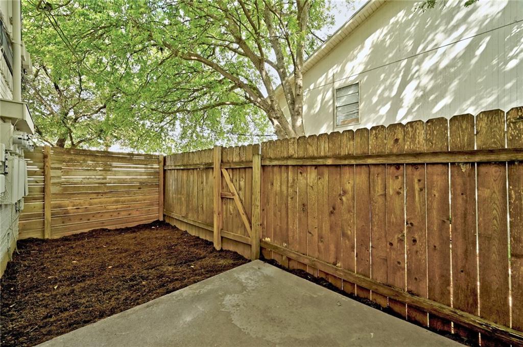 3511 Alpine Circle, Unit 1 Austin, TX 78704 - Photo 20 of 22 a view of a backyard with wooden fence