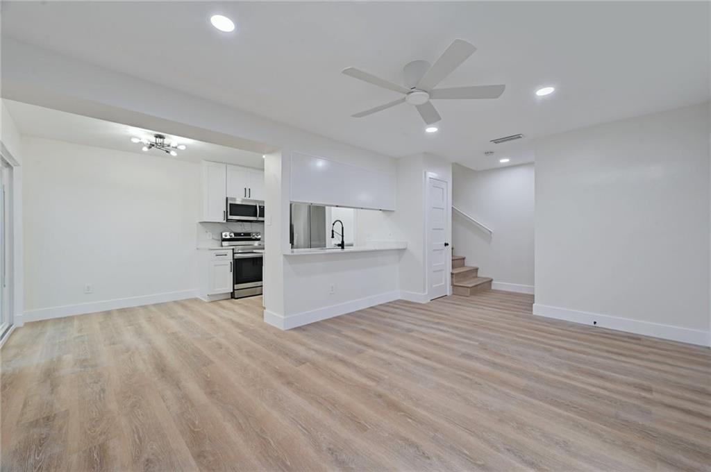 3511 Alpine Circle, Unit 1 Austin, TX 78704 - Photo 5 of 22 a view of a kitchen with a microwave and a refrigerator