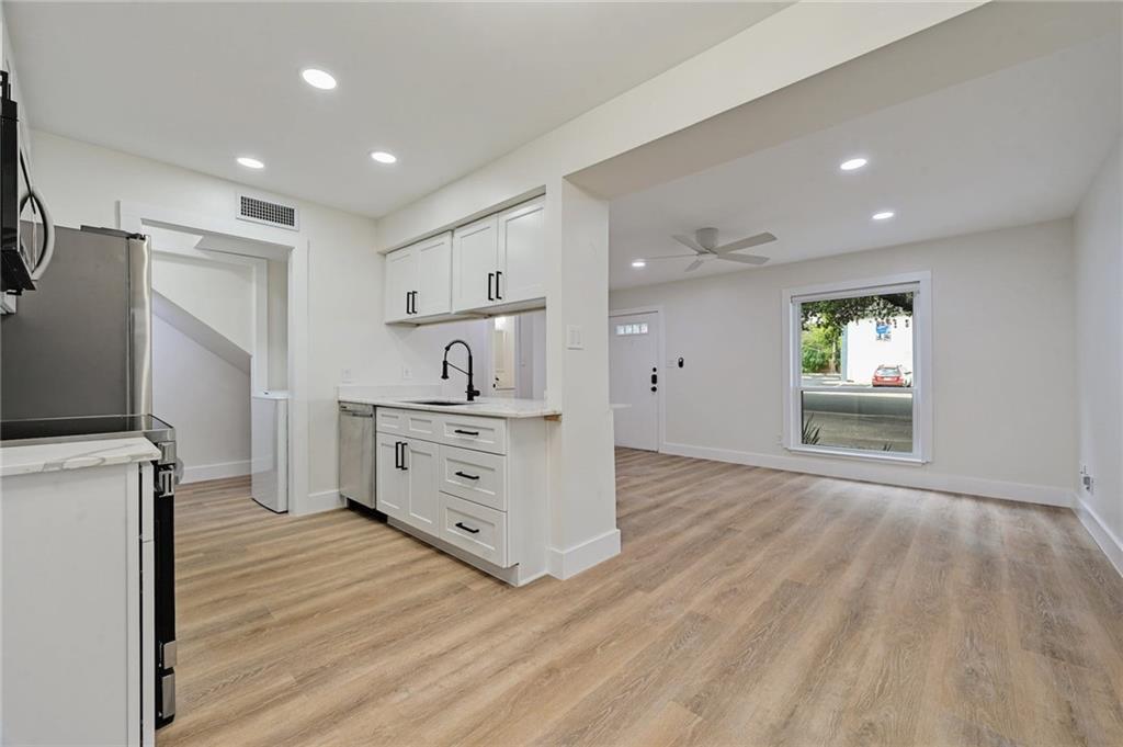 3511 Alpine Circle, Unit 1 Austin, TX 78704 - Photo 10 of 22 a view of a kitchen with microwave and cabinets