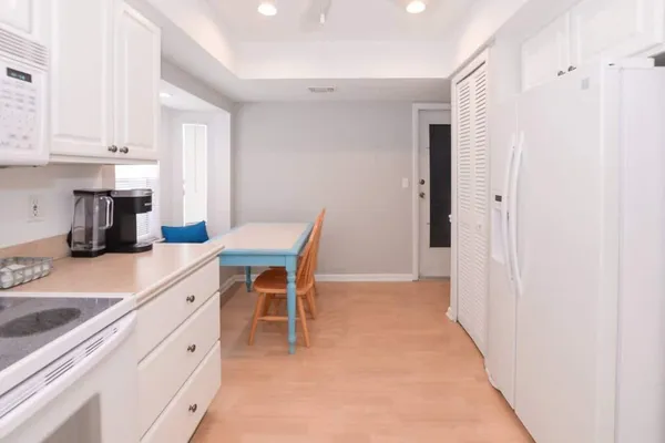 a view of a dining room with furniture and window