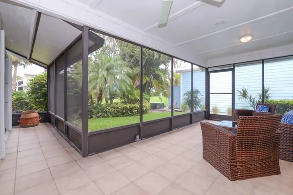 a living room with hardwood floor and balcony