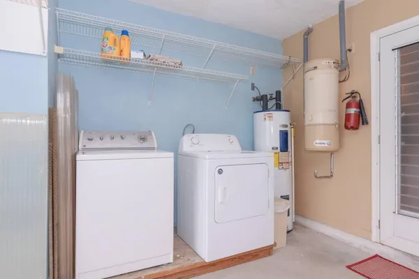 a living room filled with furniture and a gate