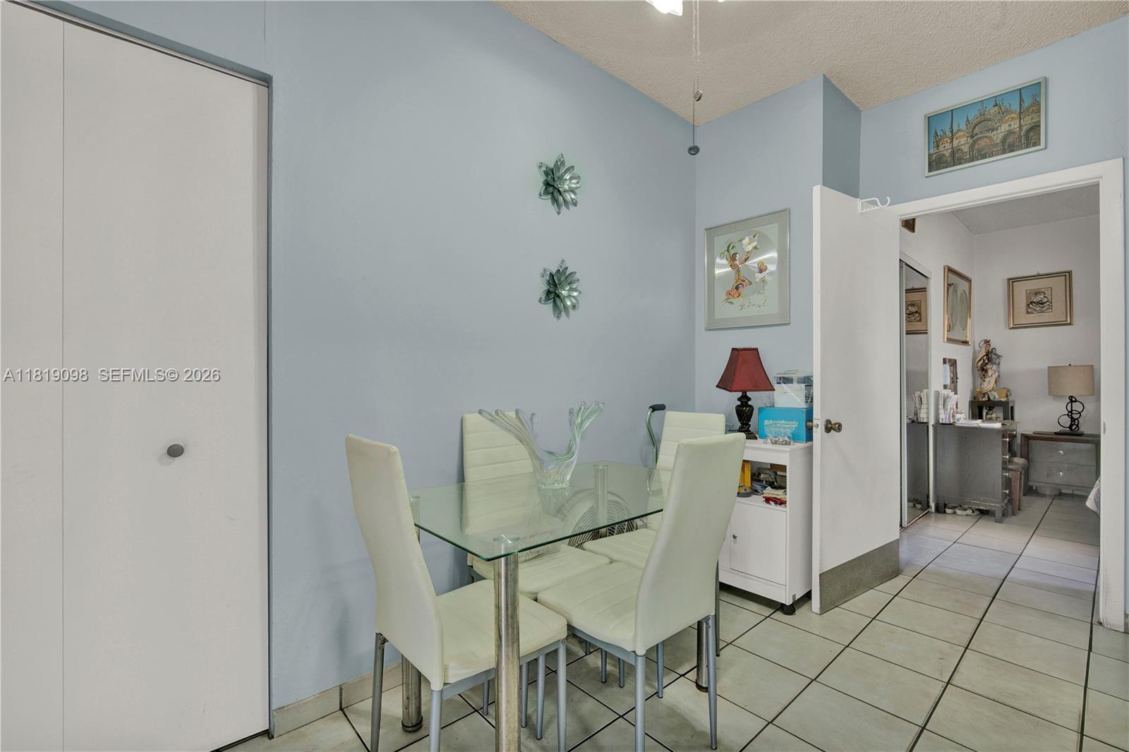 829 Southwest 19th Avenue Miami, FL 33135 - Photo 19 of 54 a living room with furniture and a dining table