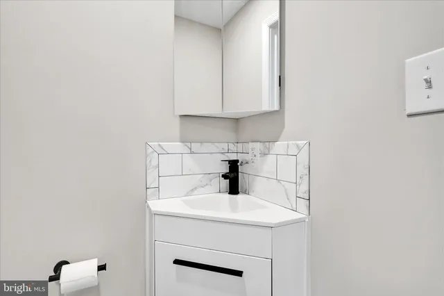 a kitchen with a sink cabinets and utility