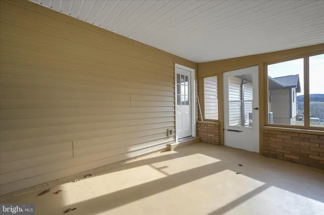 a view of an empty room and window