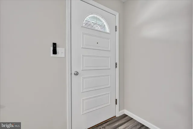 a view of front door with a washer