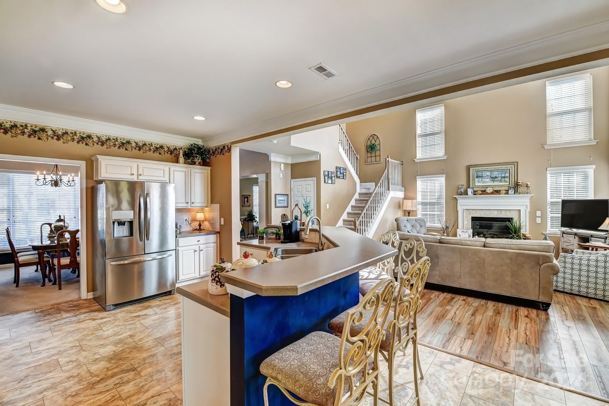 182 Harris Farm Road Mooresville, NC 28115 - Photo 11 of 46 a living room with furniture and a flat screen tv