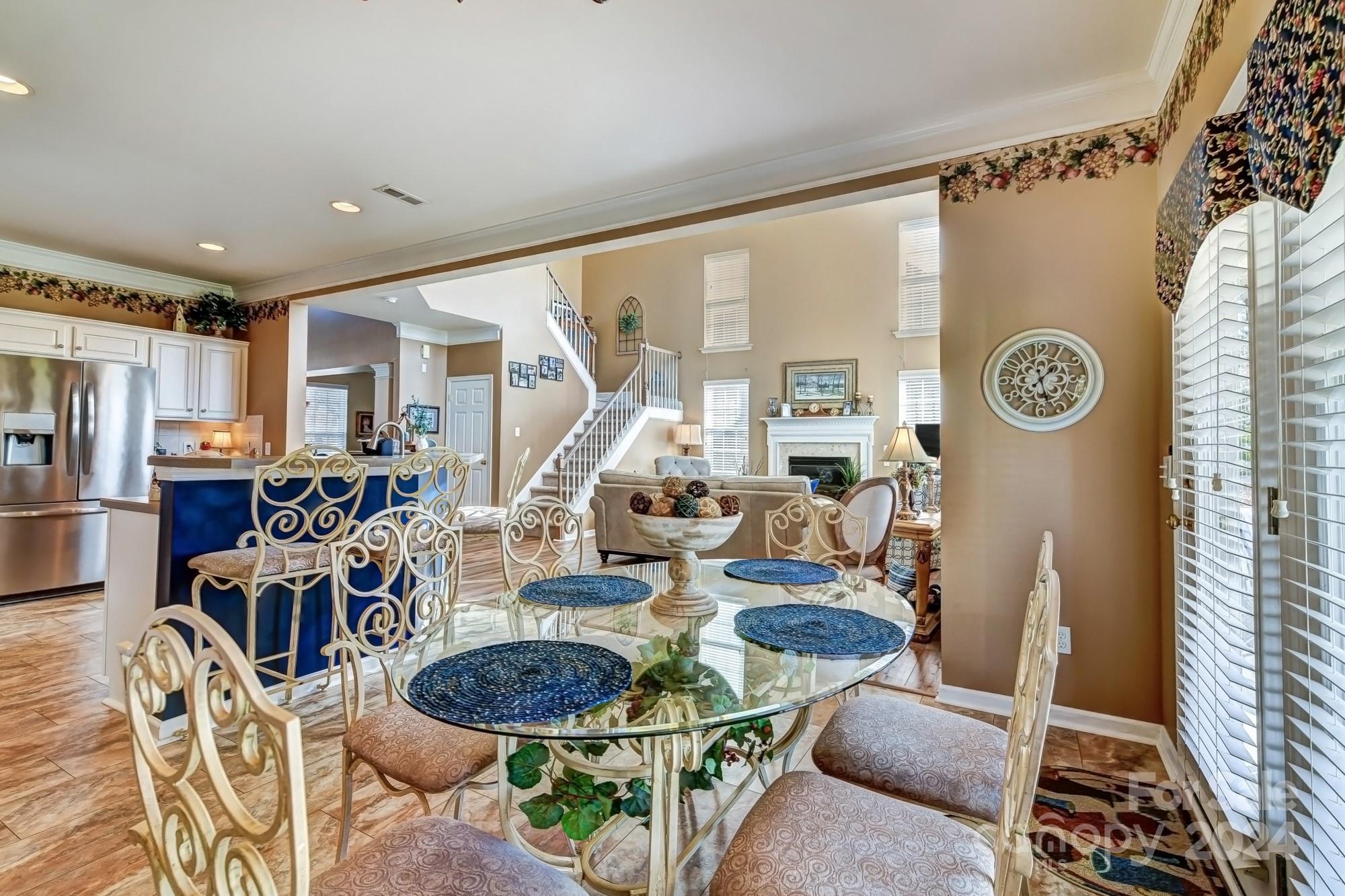 182 Harris Farm Road Mooresville, NC 28115 - Photo 15 of 46 a dining room with furniture a rug and white walls