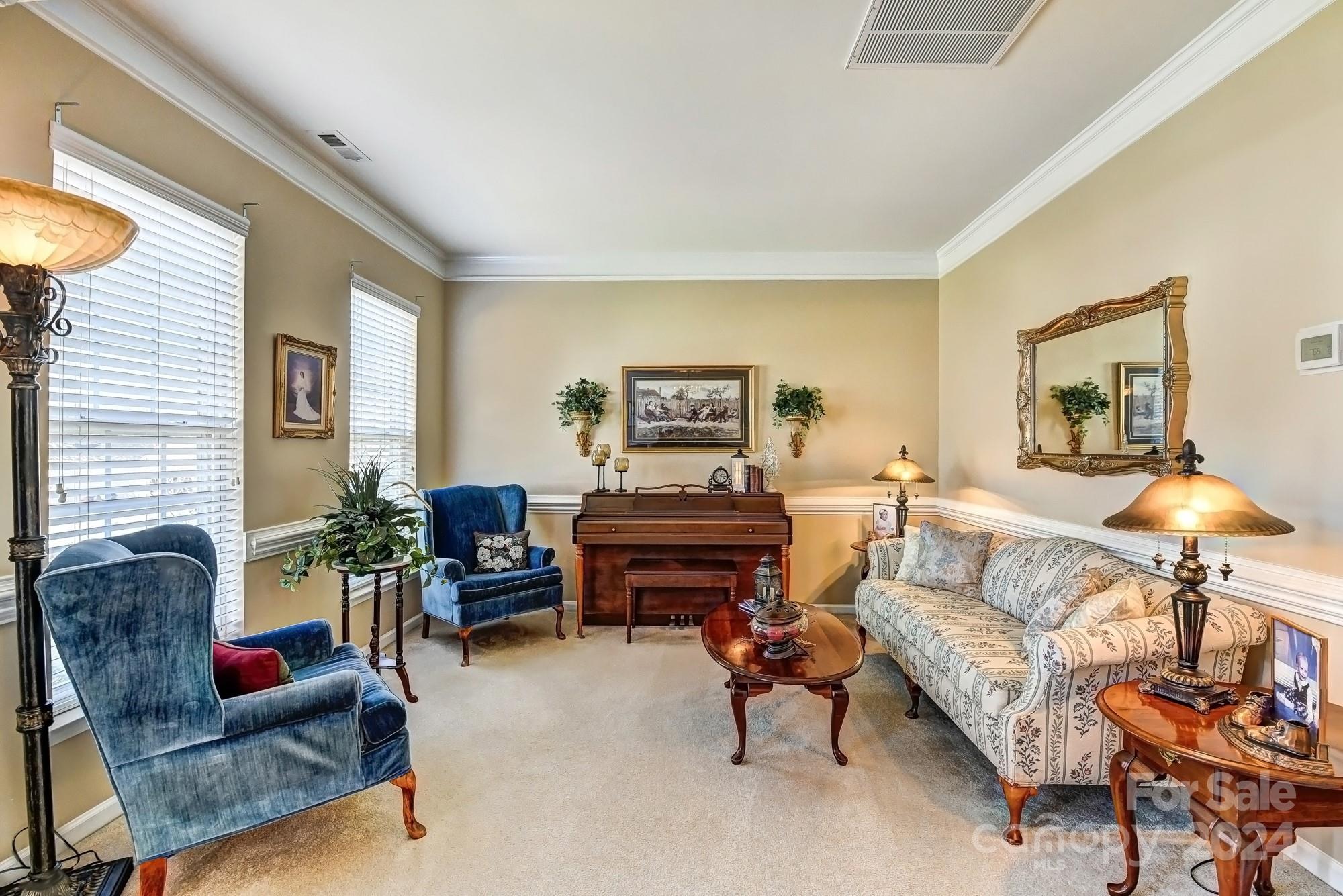 182 Harris Farm Road Mooresville, NC 28115 - Photo 18 of 46 a living room with furniture and a fireplace