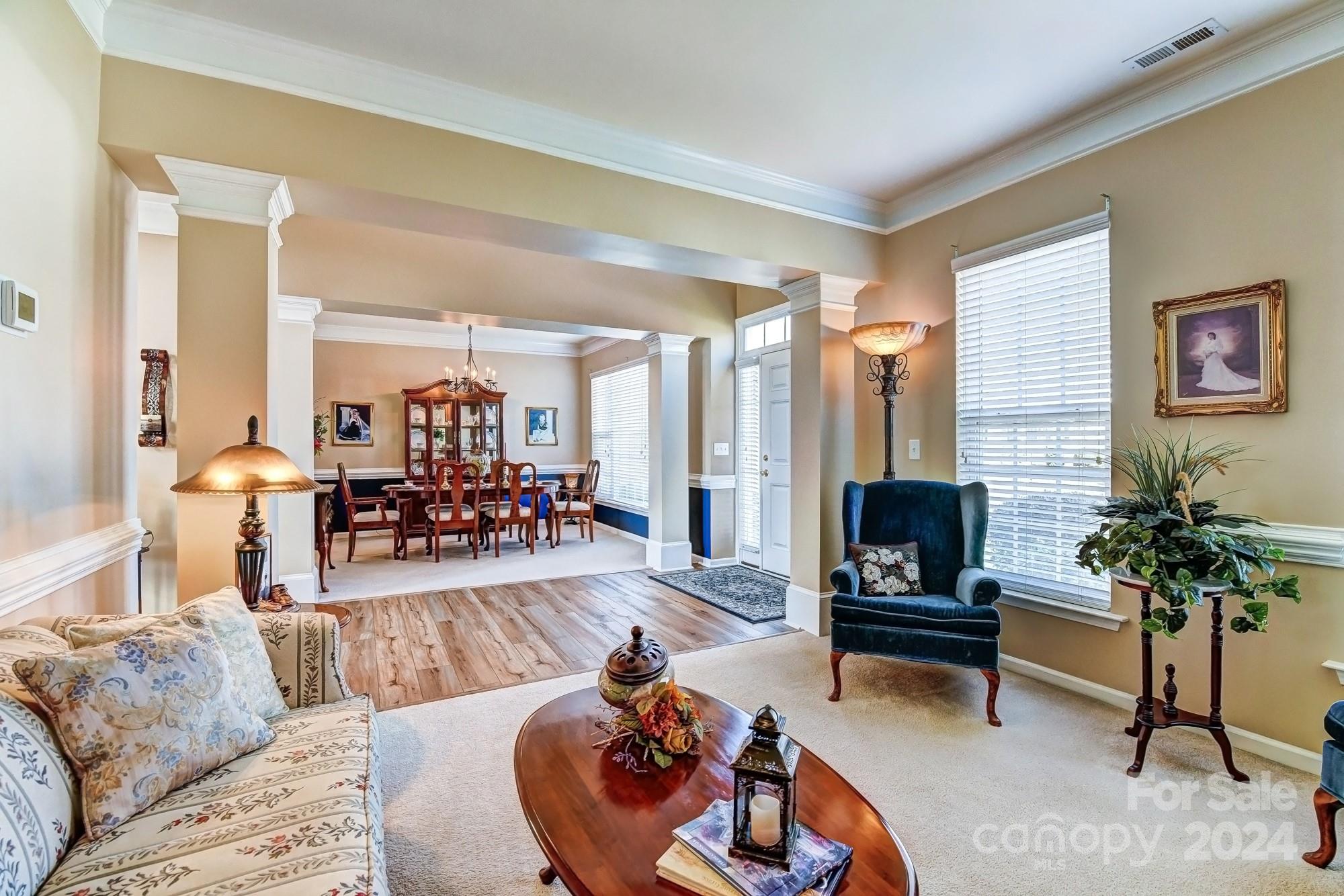182 Harris Farm Road Mooresville, NC 28115 - Photo 19 of 46 a living room with furniture and a potted plant