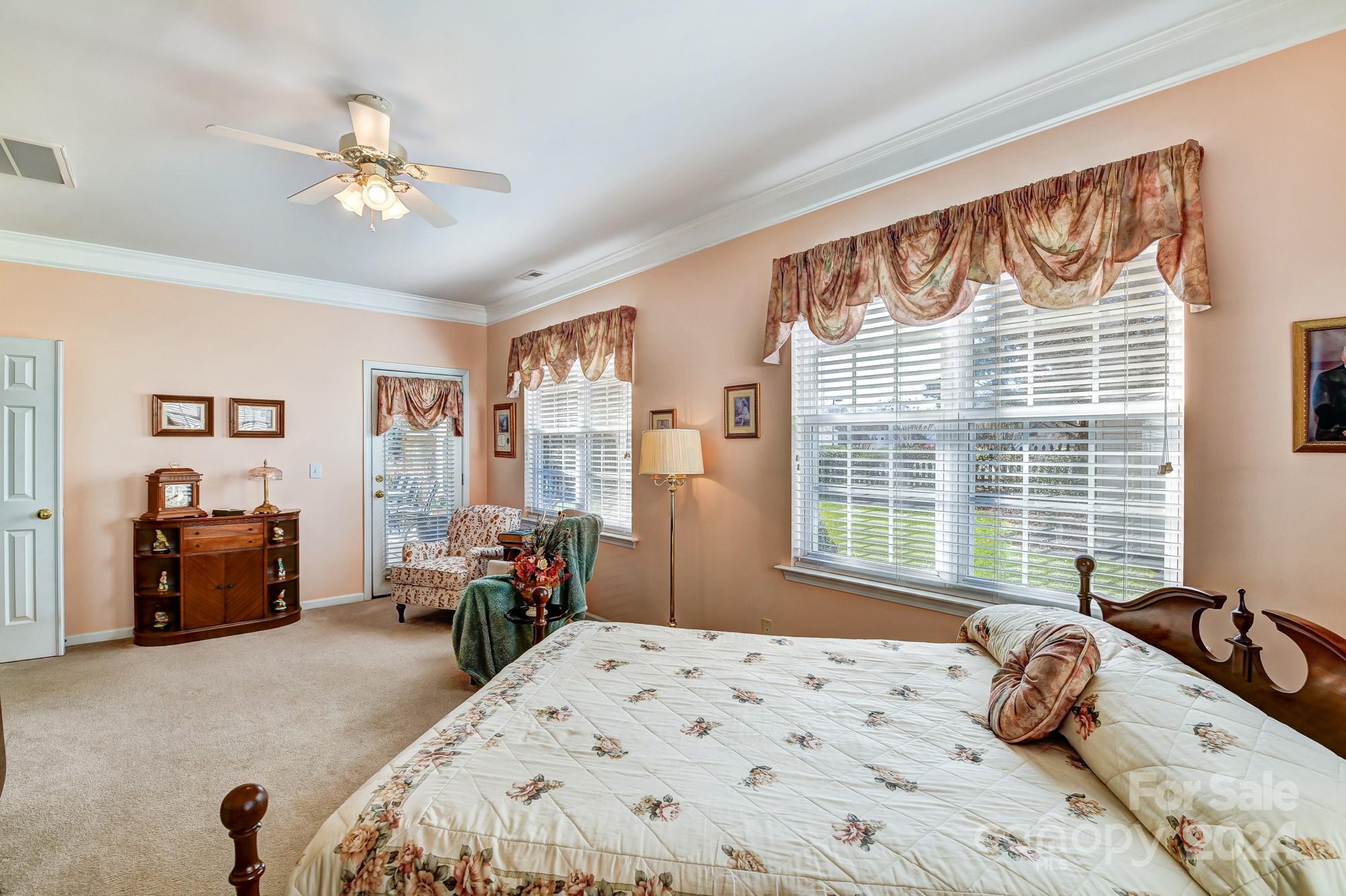 182 Harris Farm Road Mooresville, NC 28115 - Photo 23 of 46 a bedroom with a bed and gym equipment