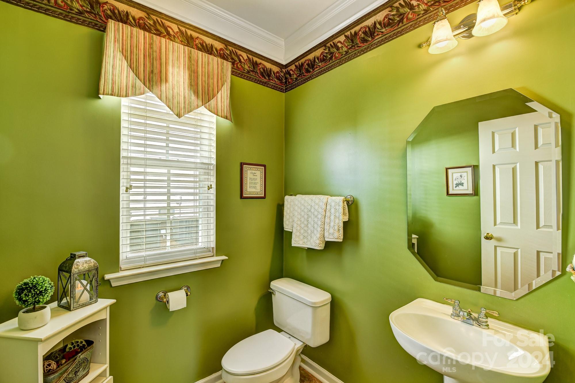 182 Harris Farm Road Mooresville, NC 28115 - Photo 24 of 46 a bathroom with a toilet sink and mirror