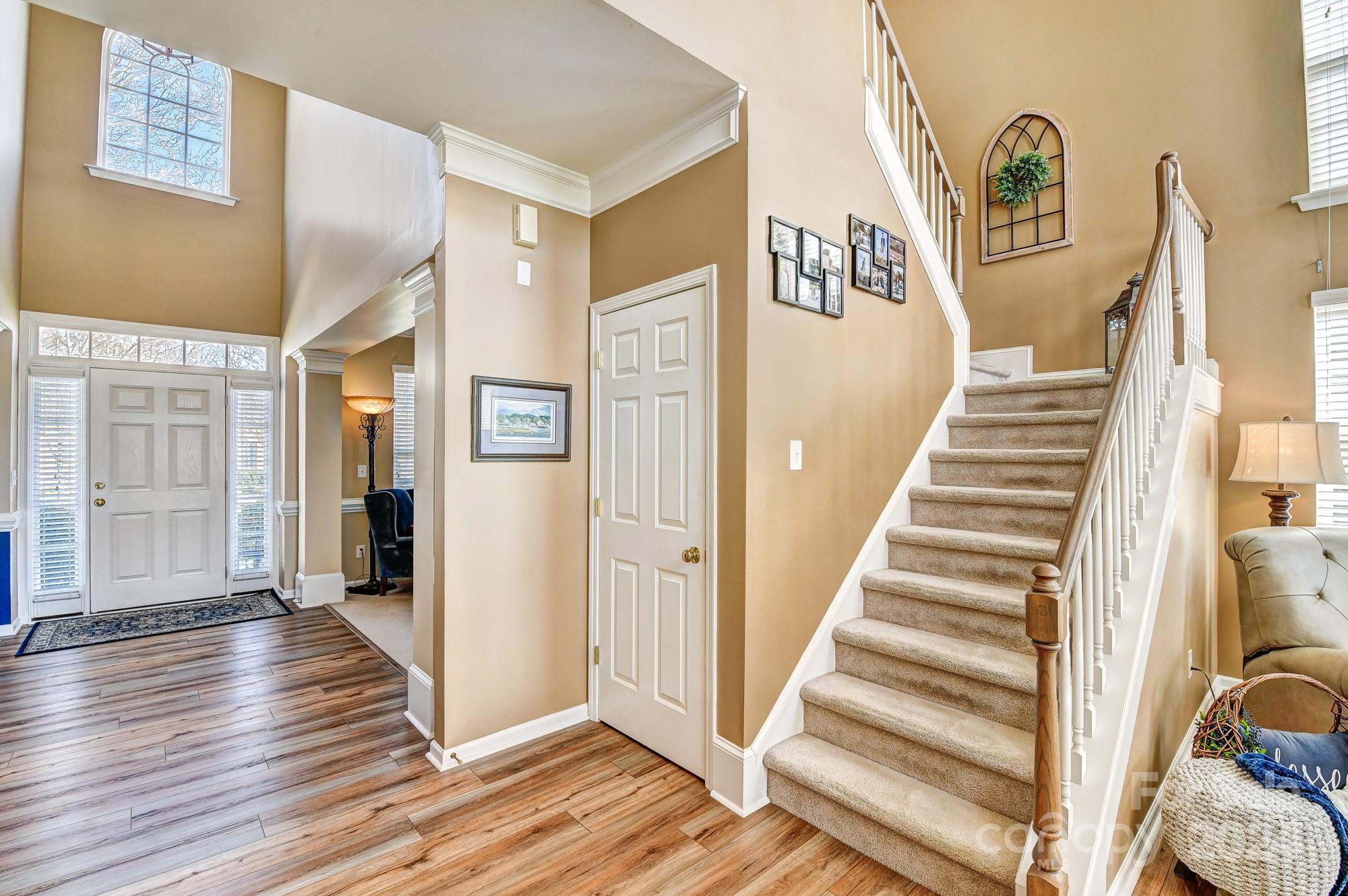 182 Harris Farm Road Mooresville, NC 28115 - Photo 25 of 46 a view of a hallway with wooden floor and entryway