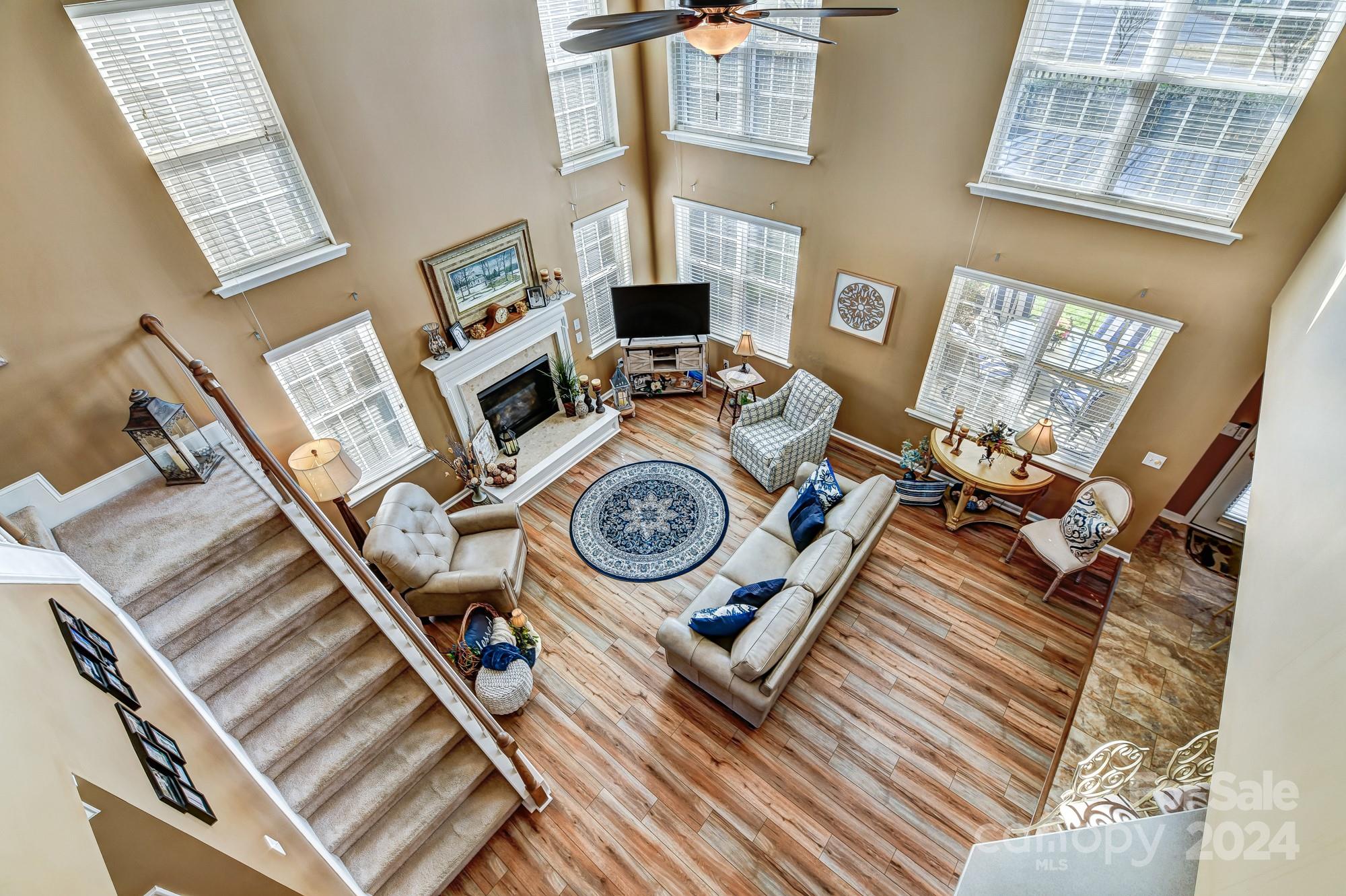 182 Harris Farm Road Mooresville, NC 28115 - Photo 26 of 46 a view of a living room with furniture and a fireplace