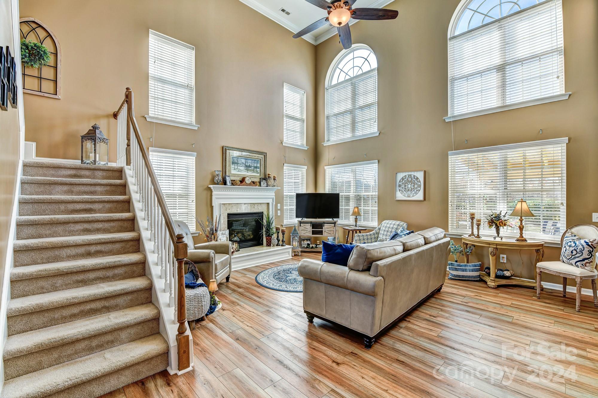 182 Harris Farm Road Mooresville, NC 28115 - Photo 3 of 46 a living room with fireplace furniture and a large window