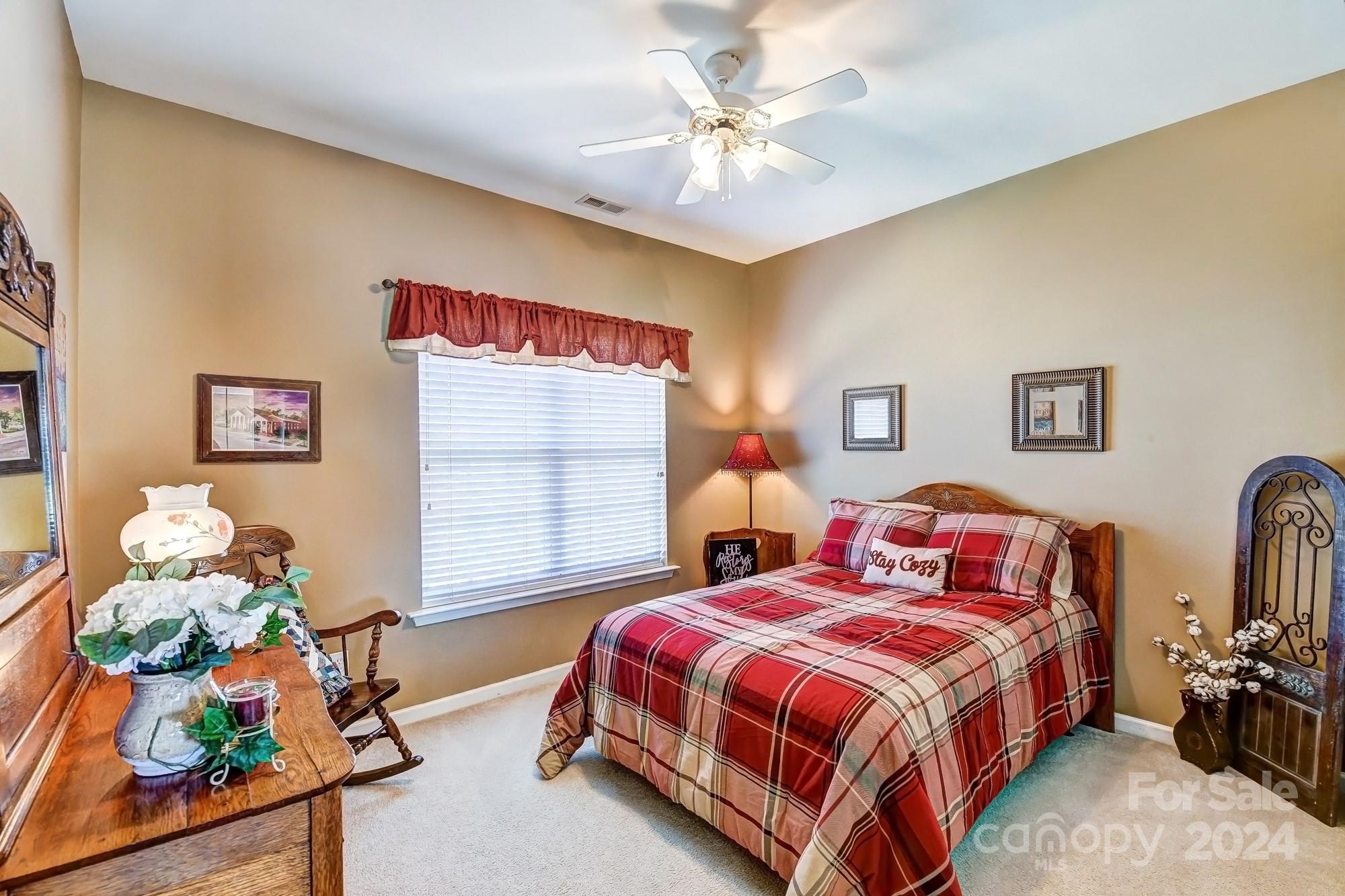 182 Harris Farm Road Mooresville, NC 28115 - Photo 36 of 46 a bedroom with bed and a window