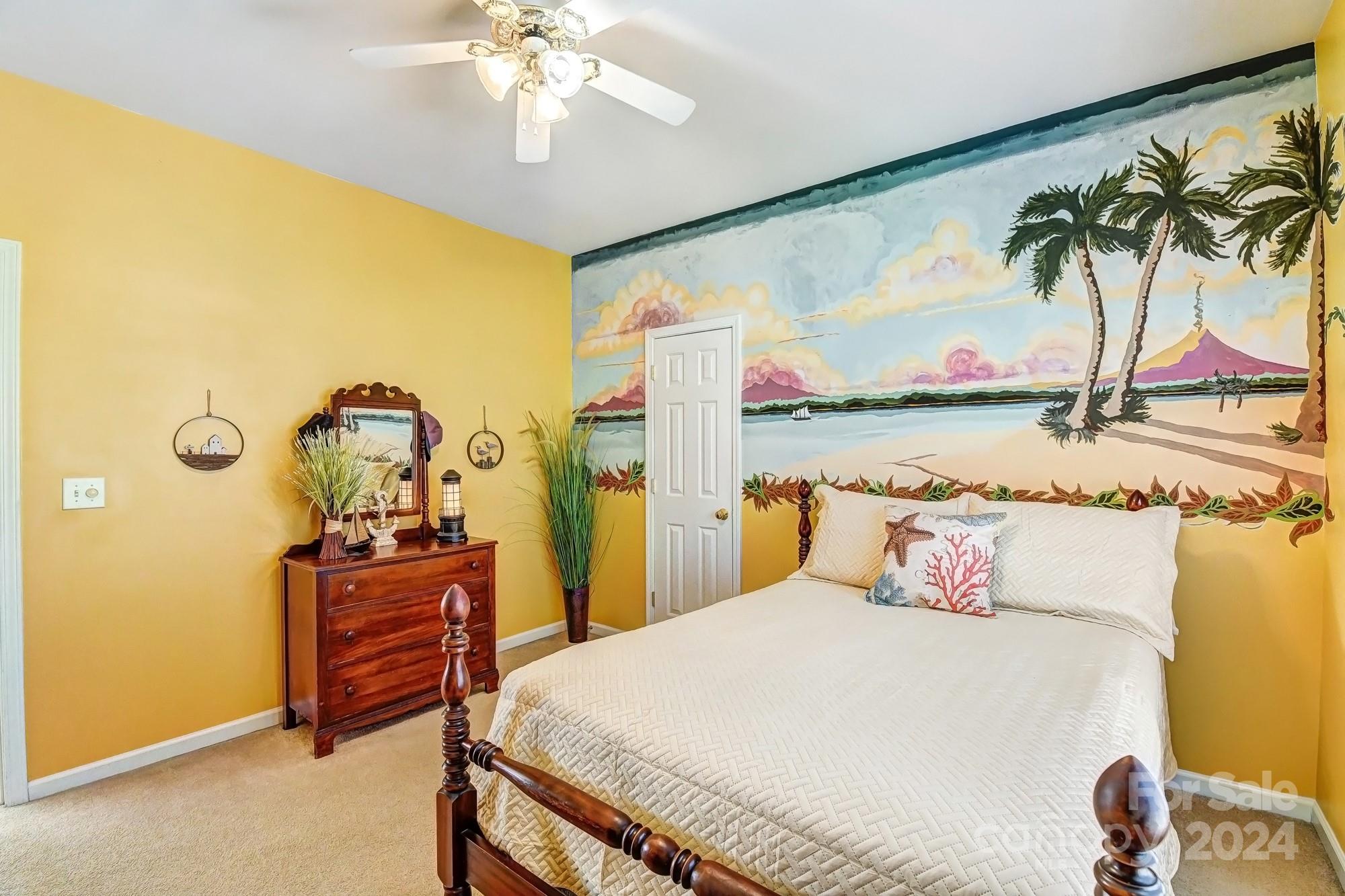 182 Harris Farm Road Mooresville, NC 28115 - Photo 39 of 46 a bedroom with a bed and ceiling fan