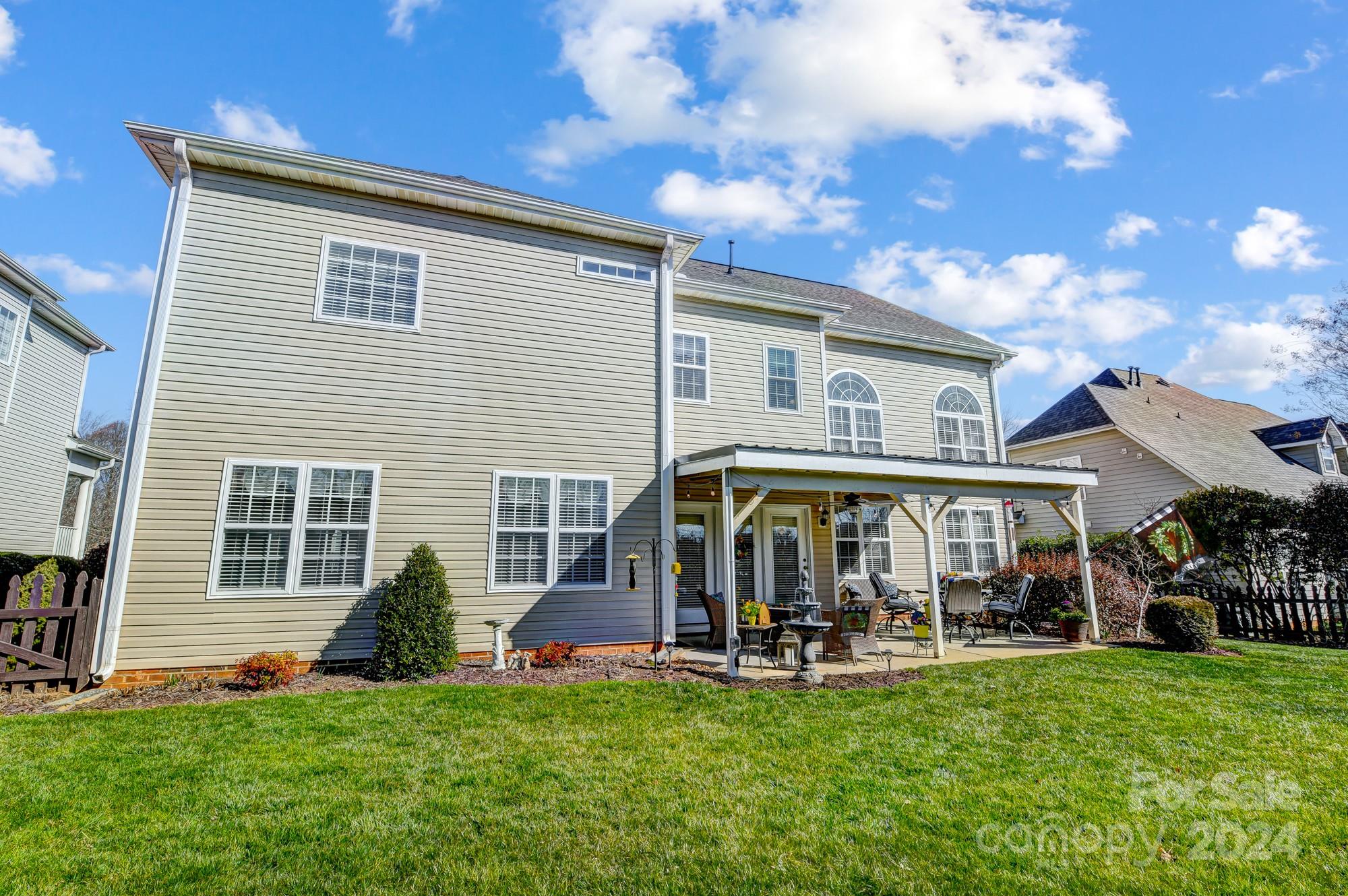 182 Harris Farm Road Mooresville, NC 28115 - Photo 44 of 46 a view of a house with a yard and sitting area