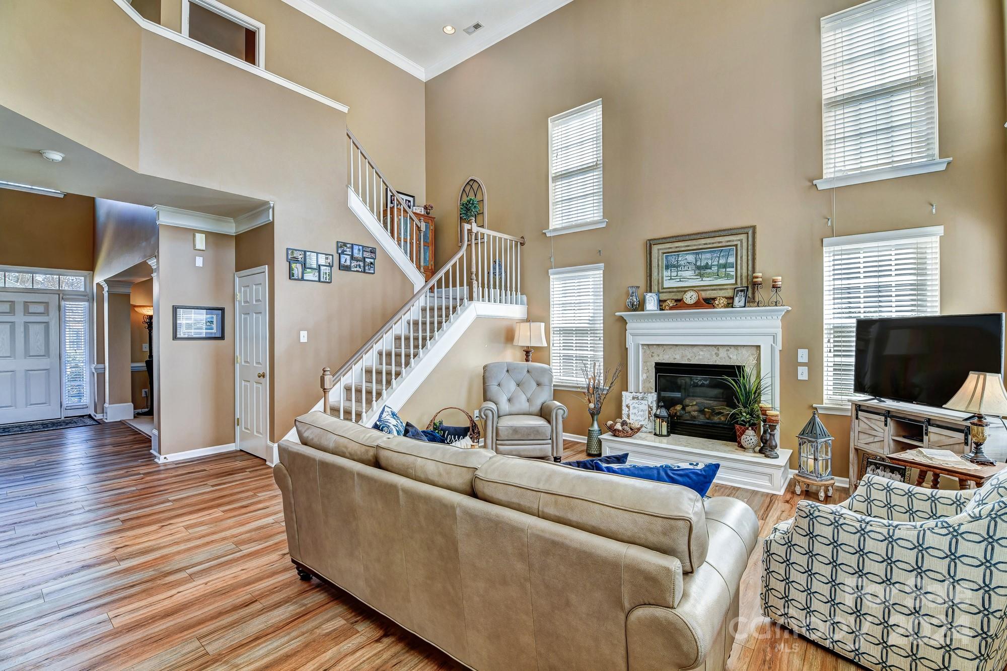 182 Harris Farm Road Mooresville, NC 28115 - Photo 5 of 46 a living room with furniture and a fireplace