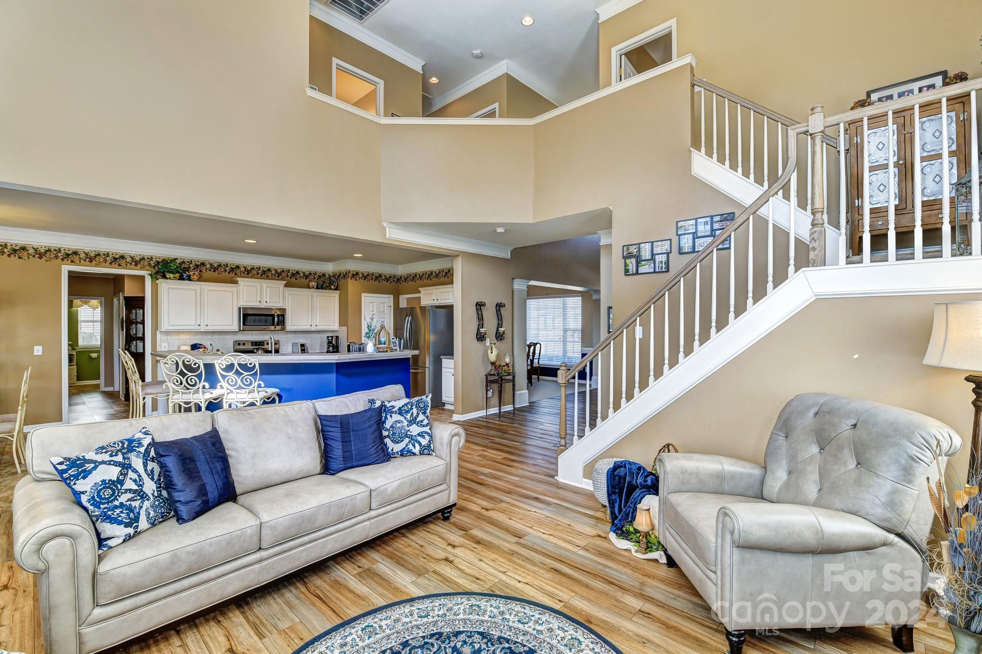 182 Harris Farm Road Mooresville, NC 28115 - Photo 6 of 46 a living room with furniture and a ceiling fan