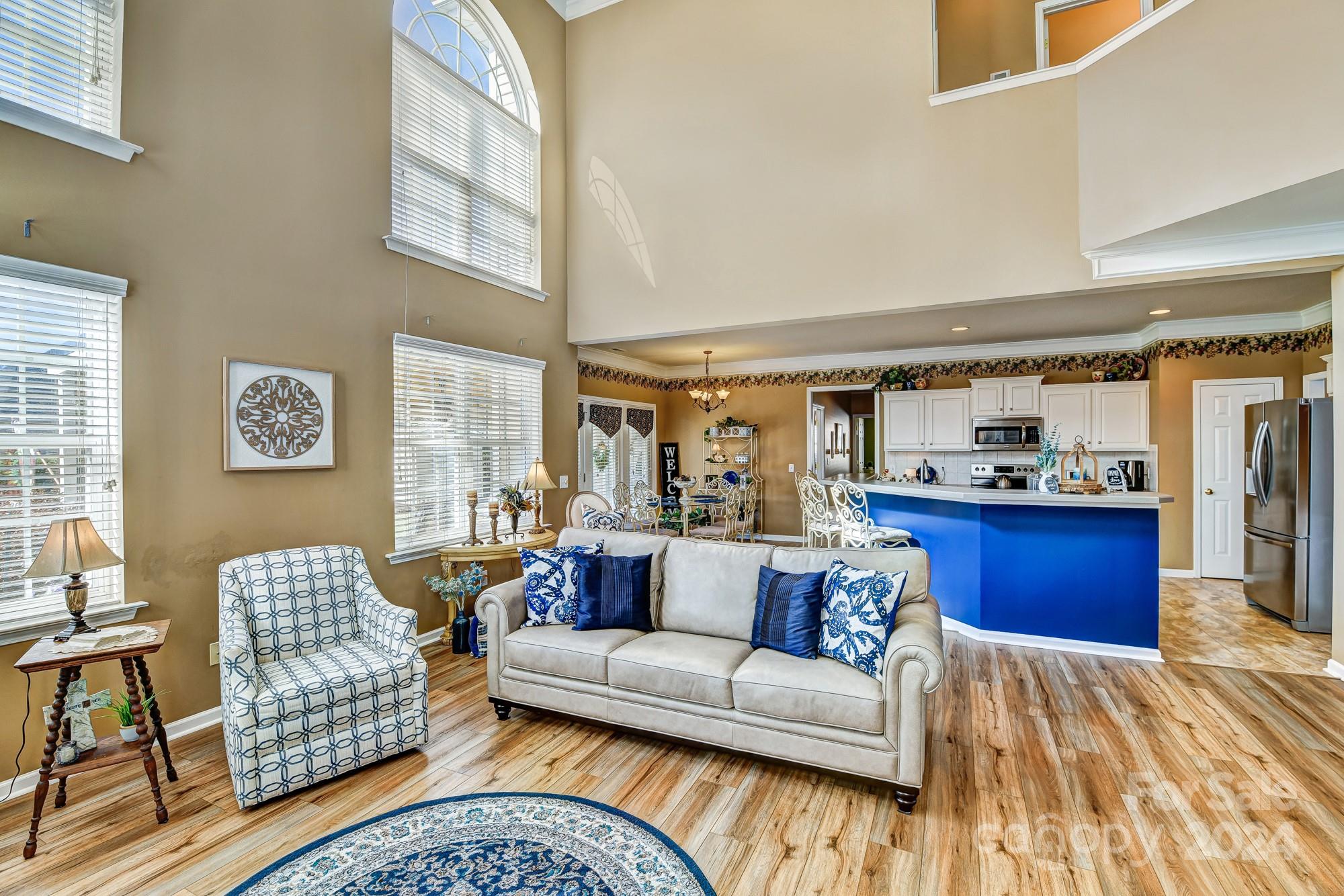 182 Harris Farm Road Mooresville, NC 28115 - Photo 7 of 46 a living room with furniture and a large window