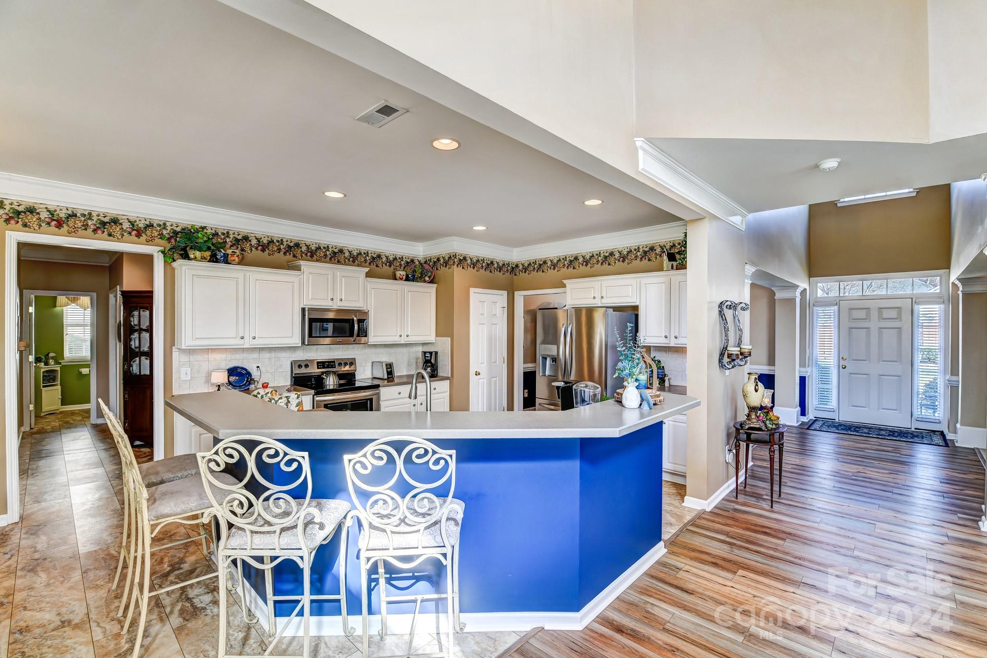 182 Harris Farm Road Mooresville, NC 28115 - Photo 8 of 46 a kitchen with stainless steel appliances kitchen island granite countertop a stove and cabinets
