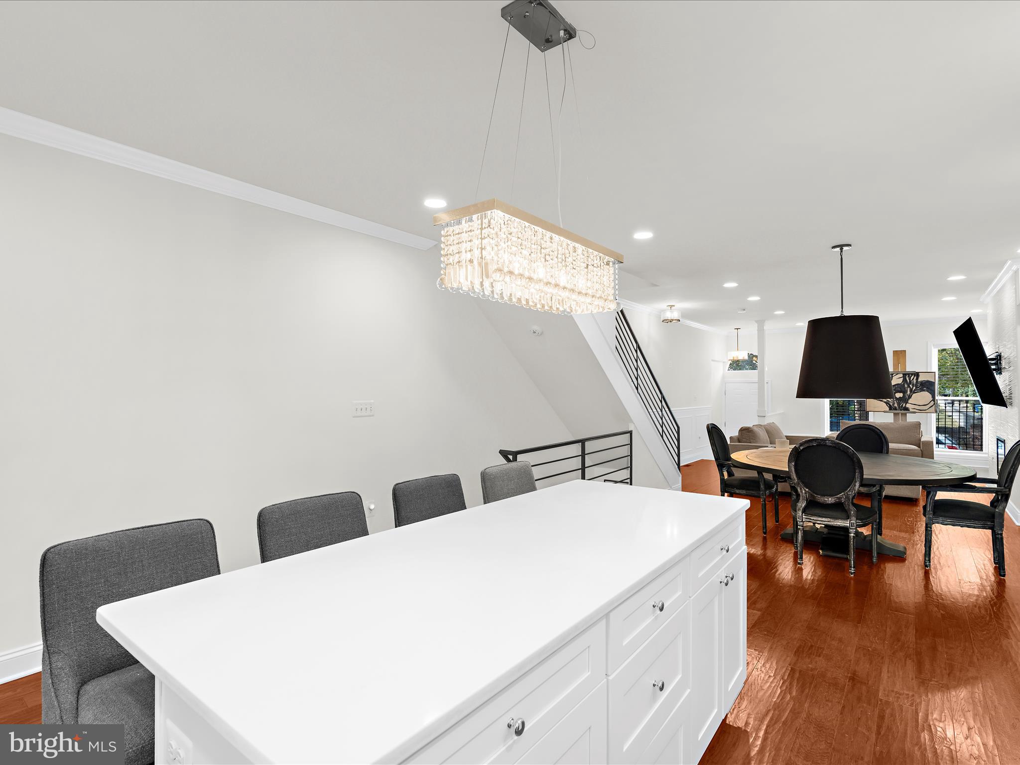 505 Mosher Street Baltimore, MD 21217 - Photo 12 of 46 a living room with couches chairs and kitchen view with wooden floor