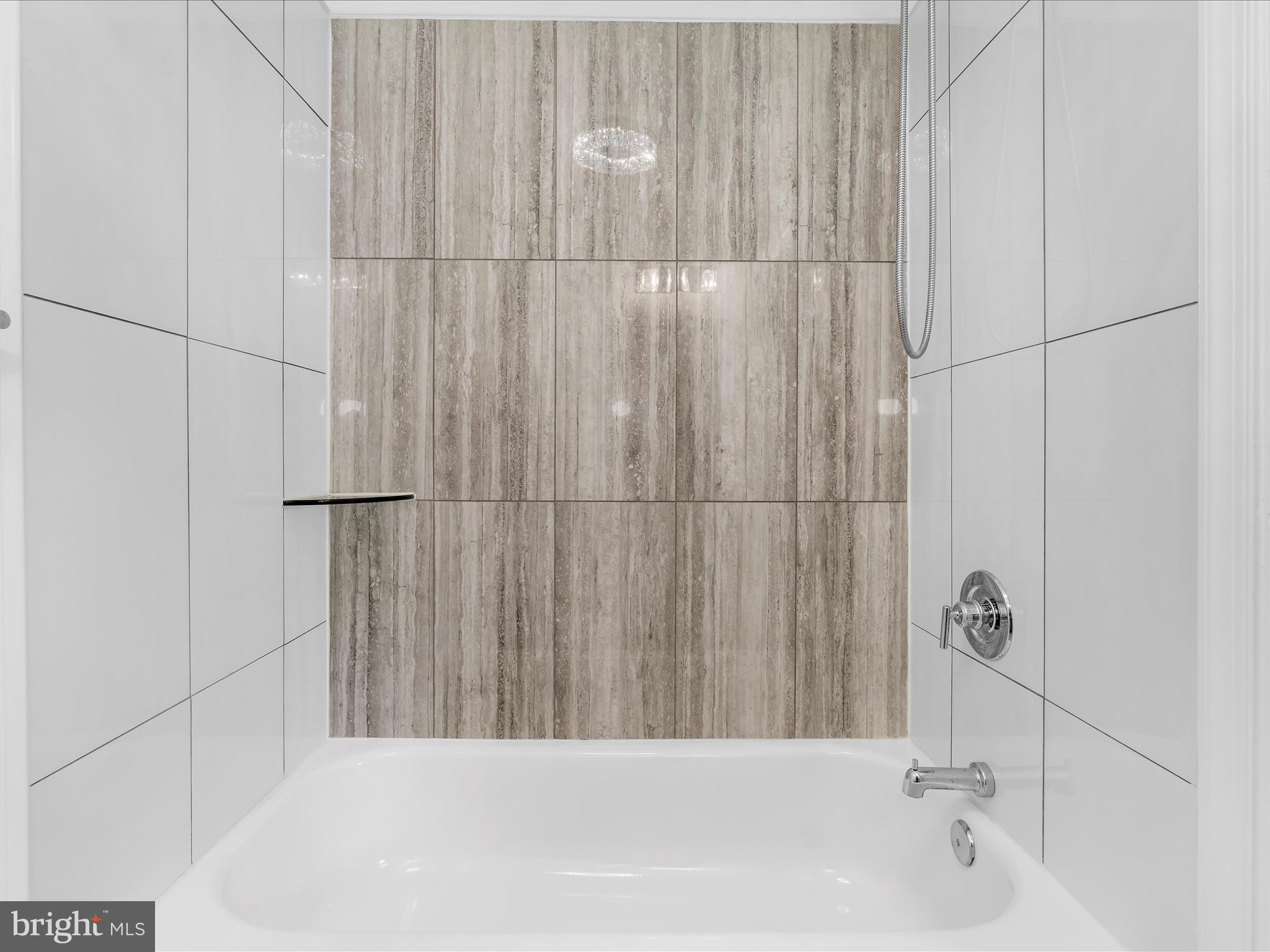 505 Mosher Street Baltimore, MD 21217 - Photo 19 of 46 a bathroom with a bathtub and shower