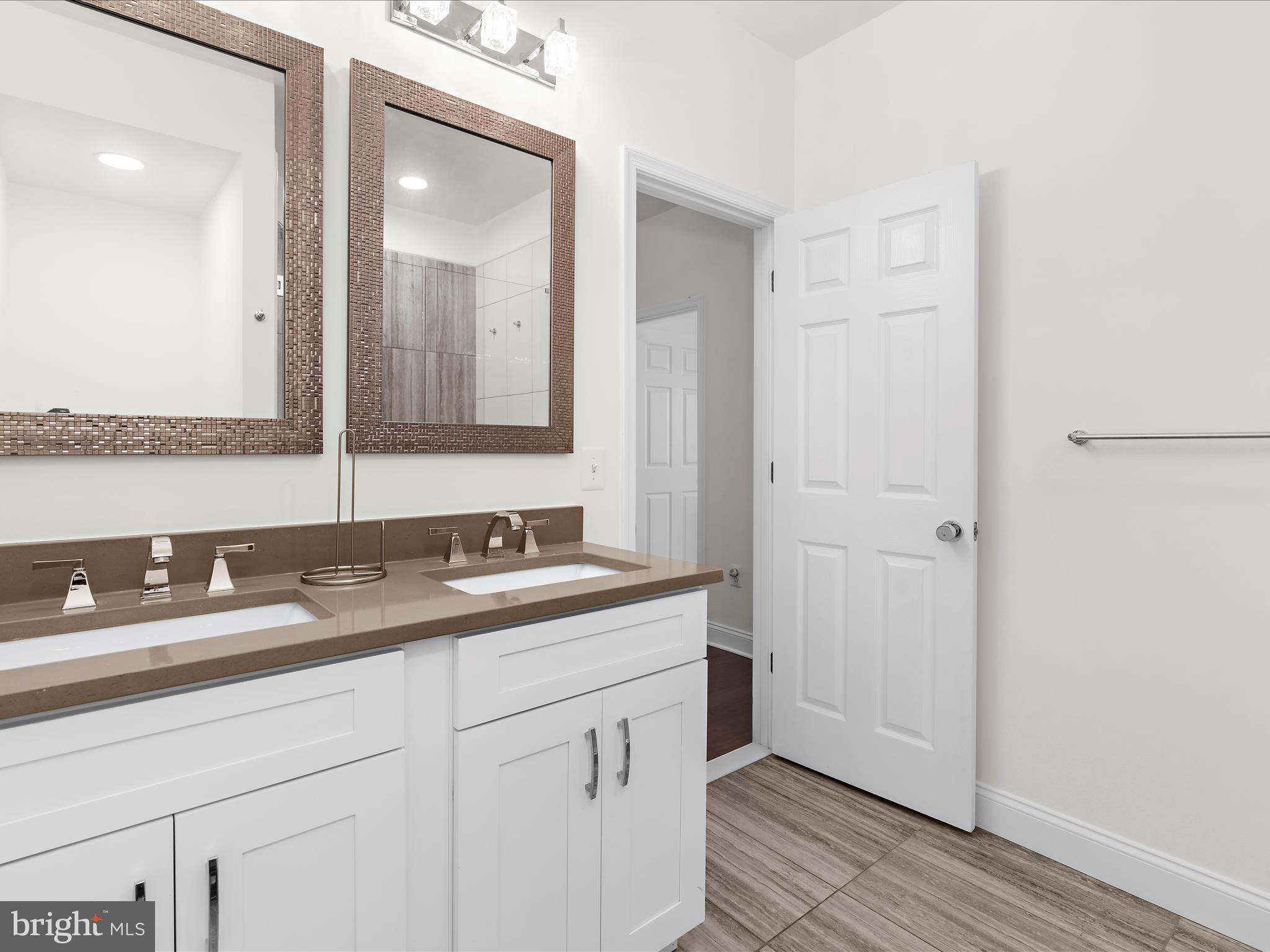 505 Mosher Street Baltimore, MD 21217 - Photo 21 of 46 a bathroom with a sink and a mirror