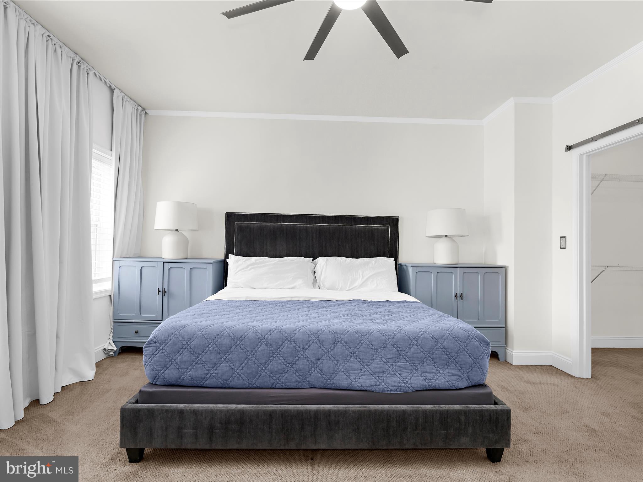 505 Mosher Street Baltimore, MD 21217 - Photo 28 of 46 a bedroom with a bed and a night stand