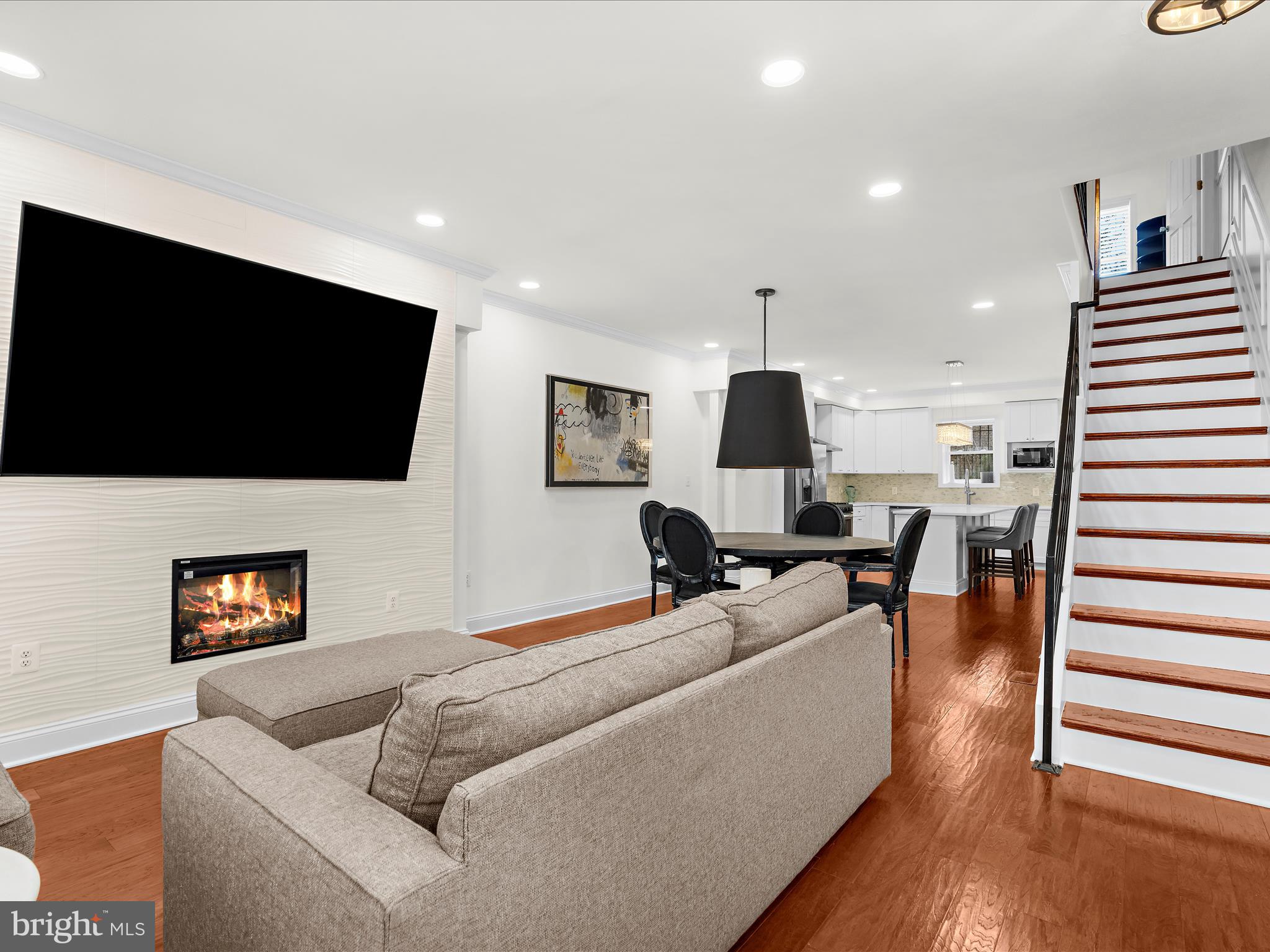 505 Mosher Street Baltimore, MD 21217 - Photo 3 of 46 a living room with furniture and a flat screen tv