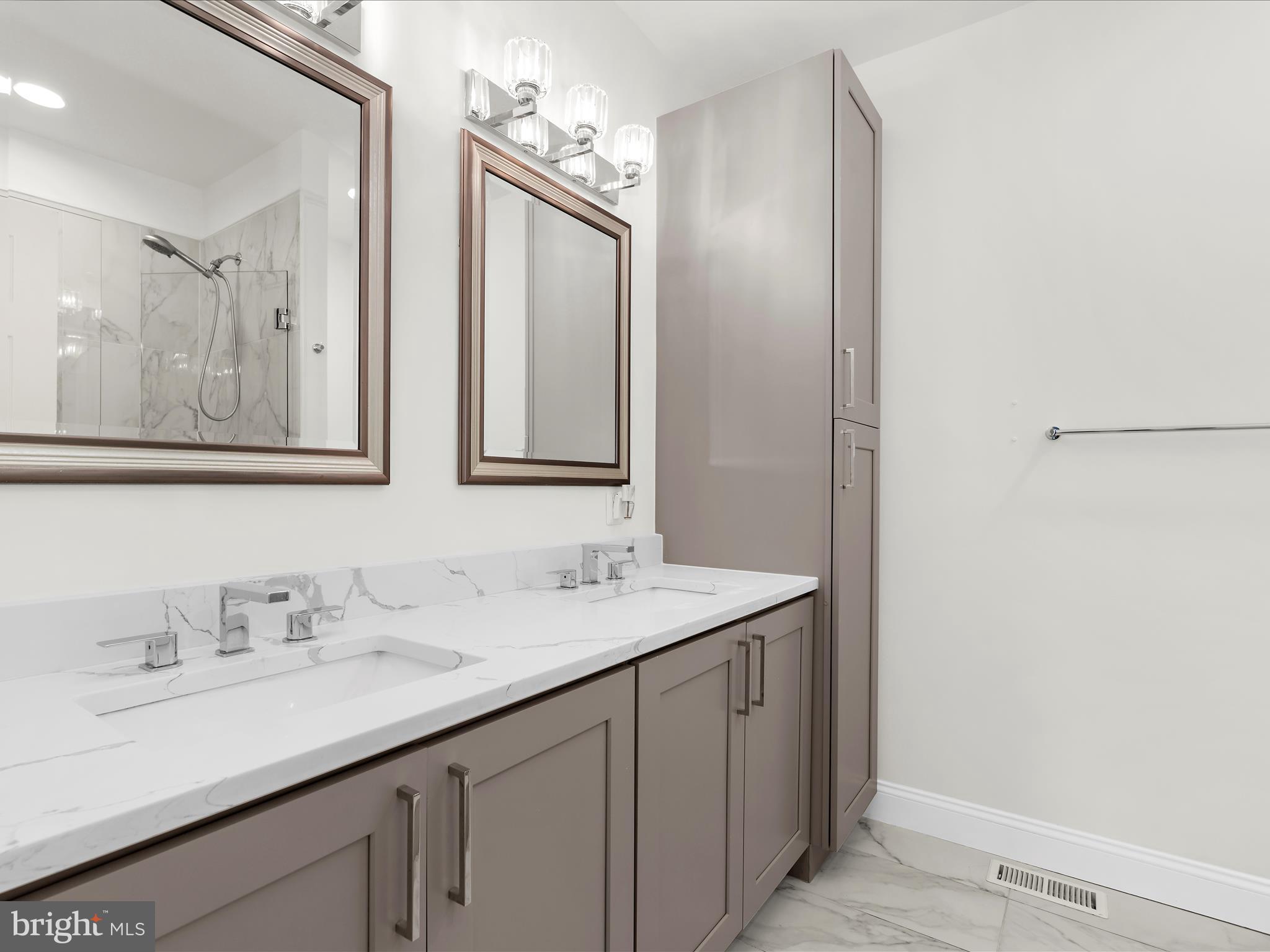 505 Mosher Street Baltimore, MD 21217 - Photo 32 of 46 a bathroom with a sink and a mirror