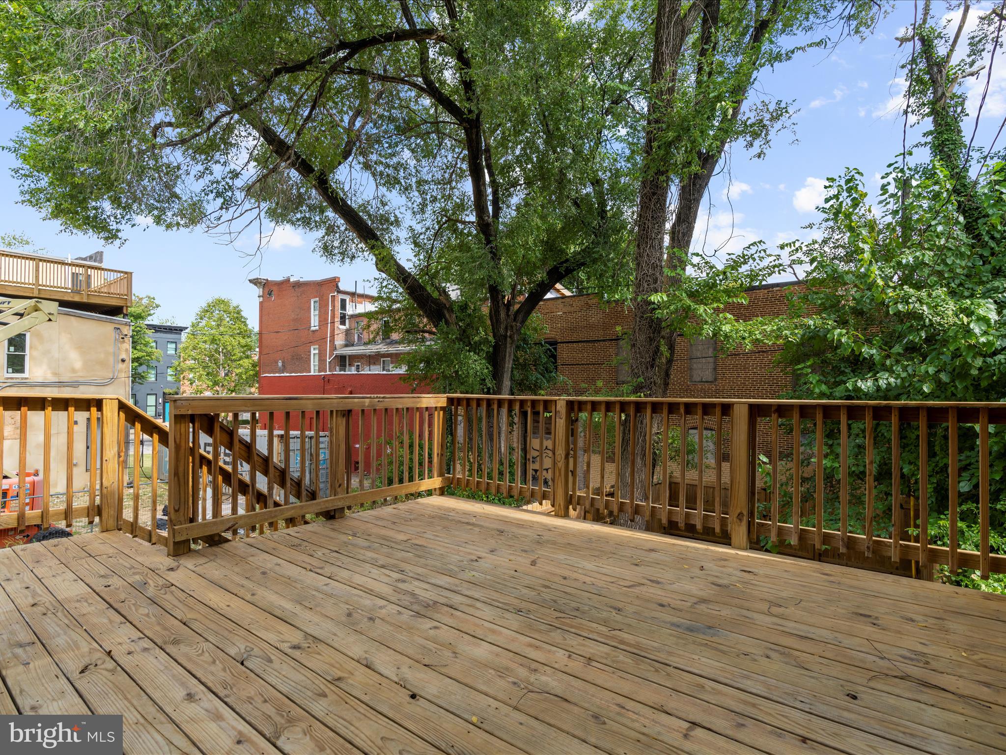 505 Mosher Street Baltimore, MD 21217 - Photo 39 of 46 a view of balcony with wooden floor and fence