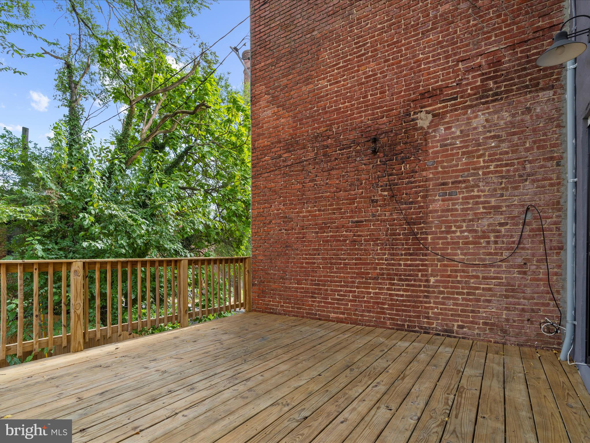505 Mosher Street Baltimore, MD 21217 - Photo 40 of 46 a view of a wooden deck