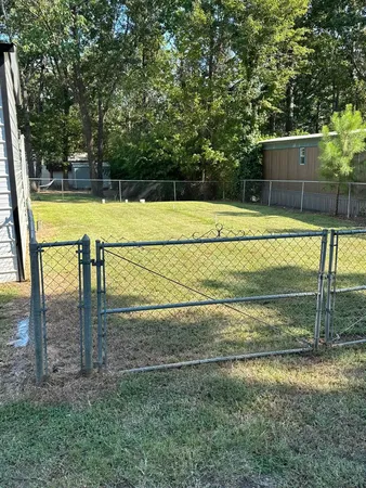 a view of a swimming pool with a backyard