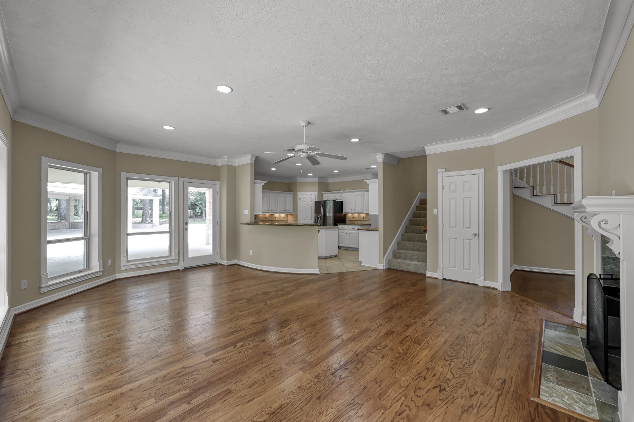 2205 Longmire Road Conroe, TX 77304 - Photo 11 of 49 Second staircase from the family room with a huge storage closet....no wasted space here!!