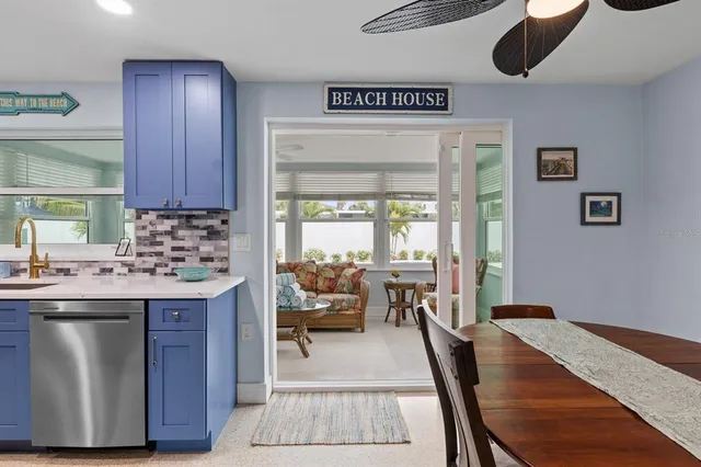 a kitchen with a table and chairs in it