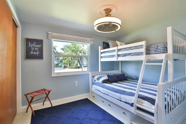 a room with a window and flowerpot