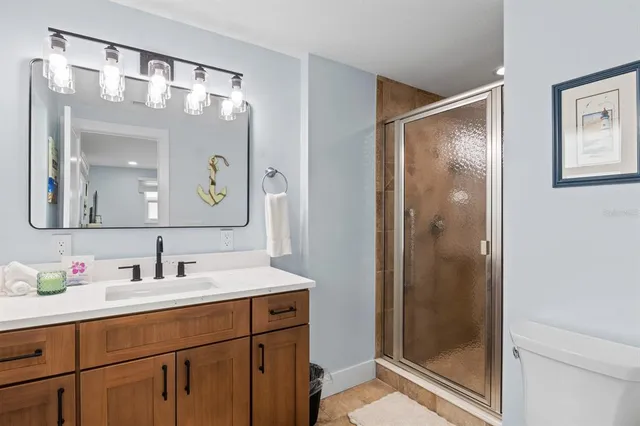a bathroom with a sink vanity and a mirror