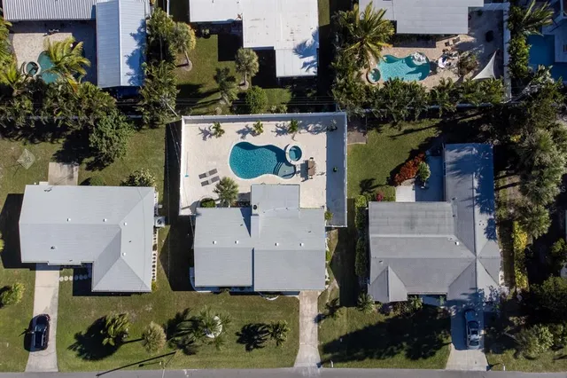 an aerial view of multiple houses with outdoor space