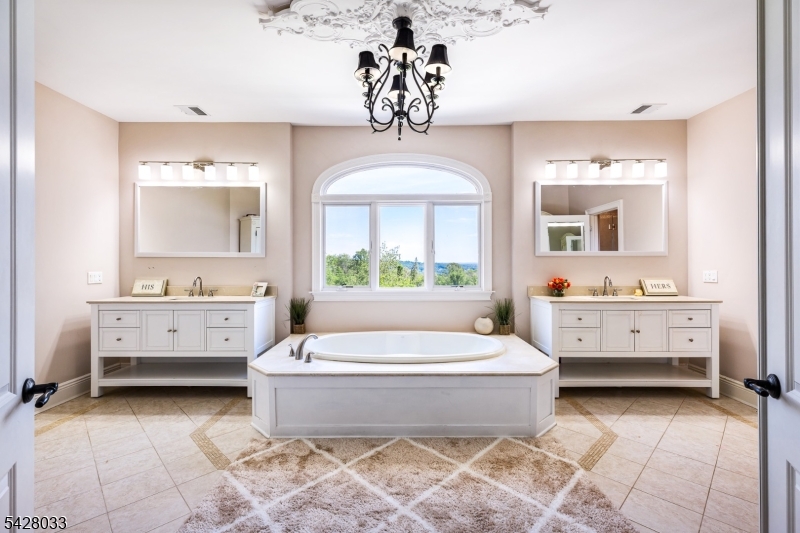 2 Chilton Road Chester, NJ 07930 - Photo 20 of 43 a en suite bathroom with a double vanity sink a mirror and a bathtub