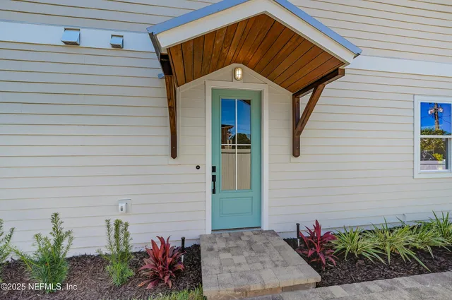 a kitchen with a sink a center island and appliances