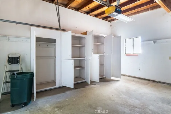 a view of empty room with ceiling fan