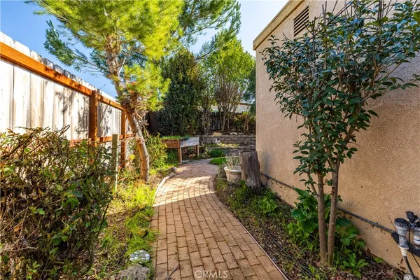 a view of yard with patio