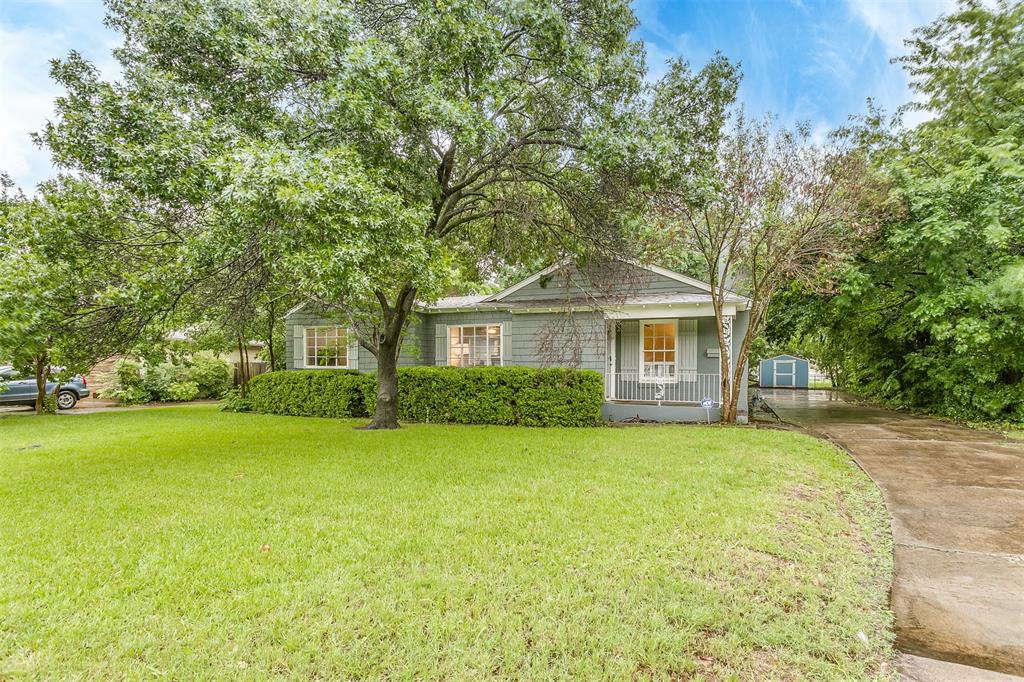 3587 Dryden Road Fort Worth, TX 76109 - Photo 1 of 1 a front view of a house with a garden