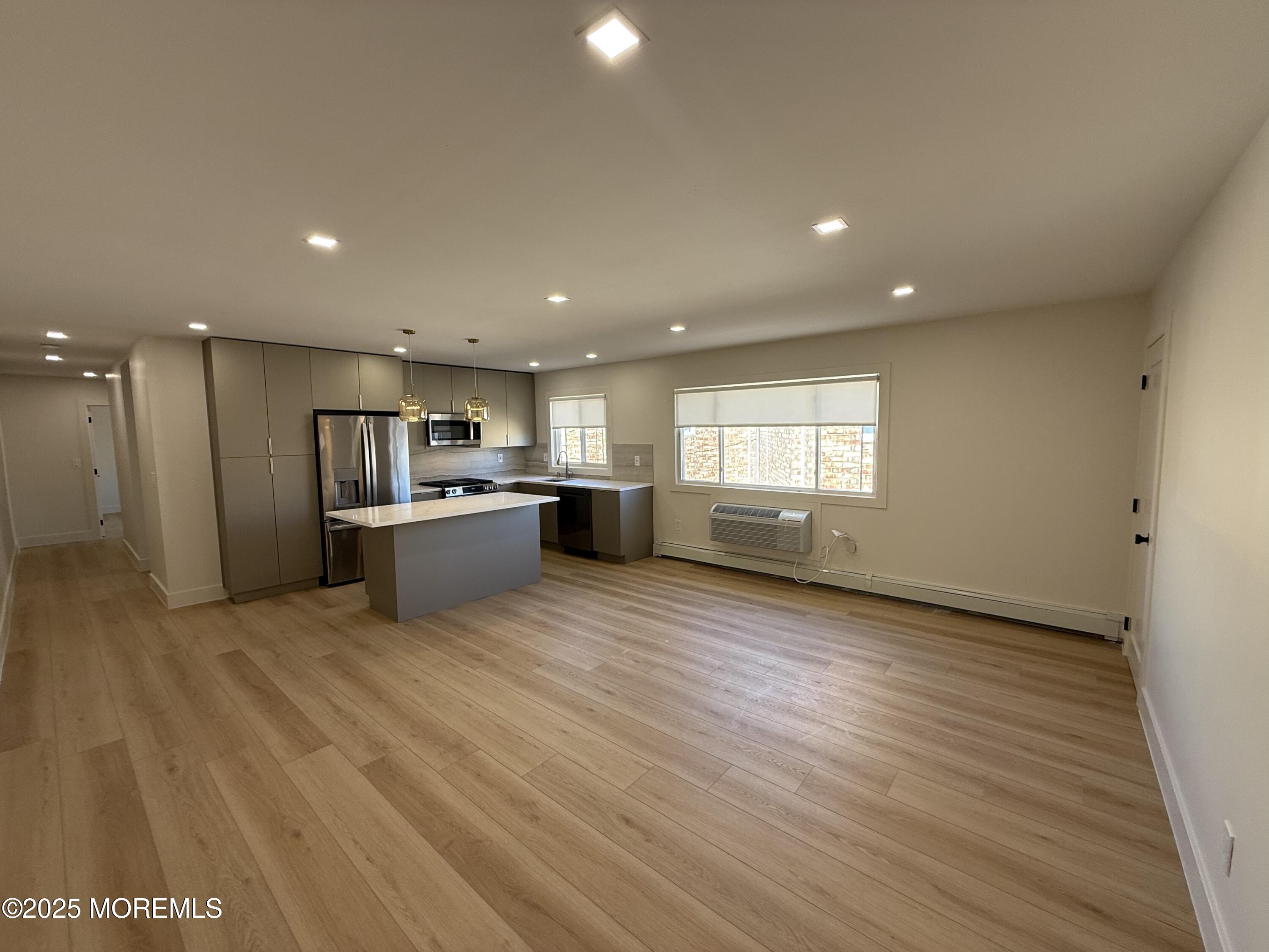 1 North Ocean Avenue, Unit 18 Belmar, NJ 07719 - Photo 2 of 10 a view of kitchen with refrigerator and window